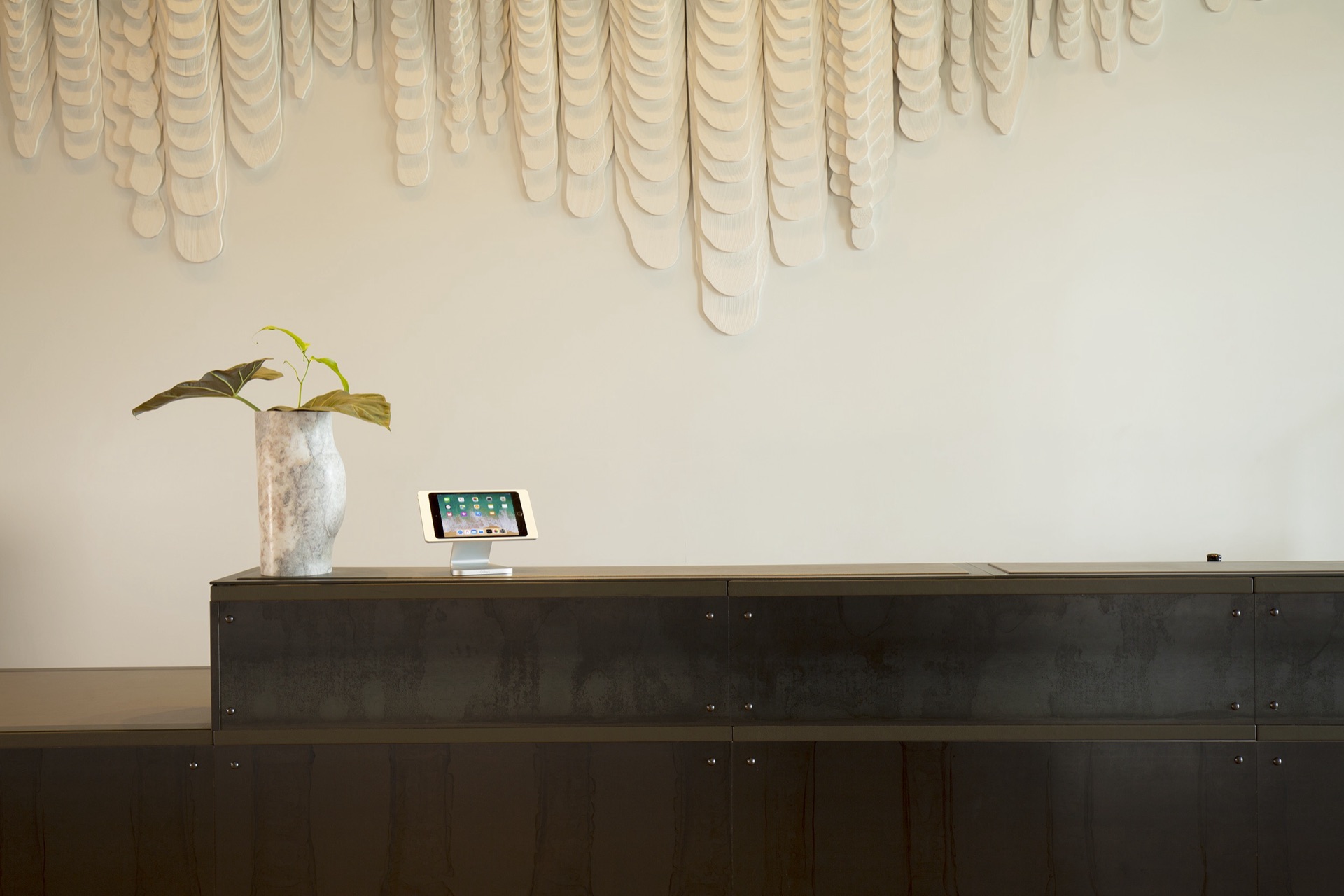 IPORT professional iPad mounting solutions in a modern interior