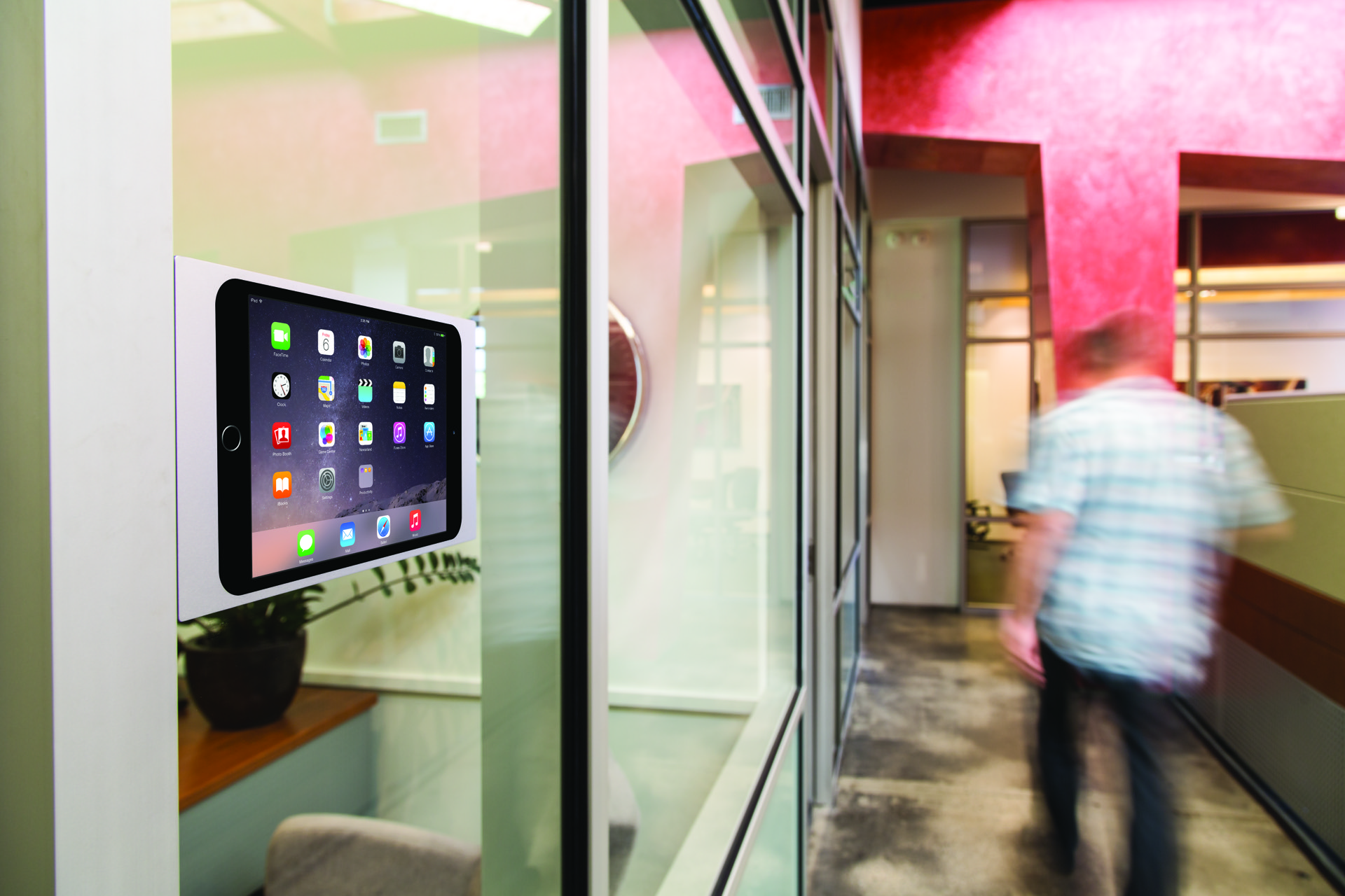 IPORT silver surface mount installed on glass in a modern interior